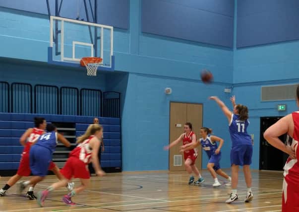ON THE ATTACK -- Helena Palmer in the thick of the action for Derbyshire Gems in their win against Barrow Thorns.