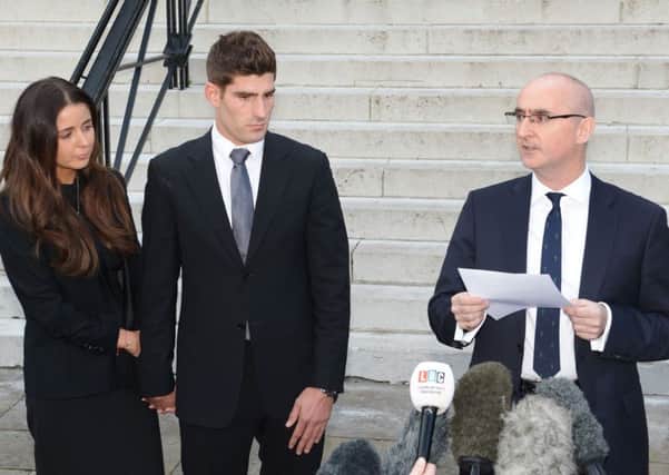 Footballer Ched Evans and partner Natasha Massey with solicitor Shaun Draycott (right) outside Cardiff Crown Court, where Evans has been found not guilty of raping a teenager in a hotel in north Wales following a two week retrial. PRESS ASSOCIATION Photo. Picture date: Friday October 14, 2016. See PA story COURTS Evans. Photo credit should read: Ben Birchall/PA Wire