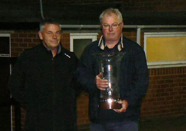 WINNER -- Chris Mordue (right) receives the beautiful Arthur Johnson Memorial Trophy from Ian Johnson.