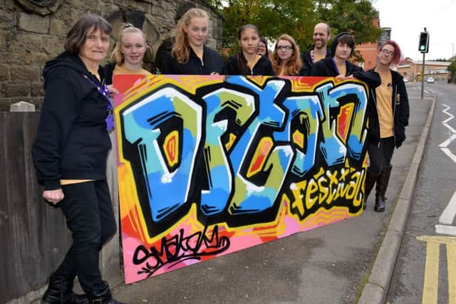 Members of the Coal Project with their artwork.