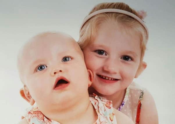 Macie, 2, and Chloe, 5, both suffer from mitochondrial disease.
