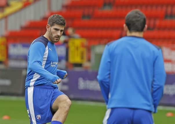 Chesterfield striker Ched Evans warms up at The Valley