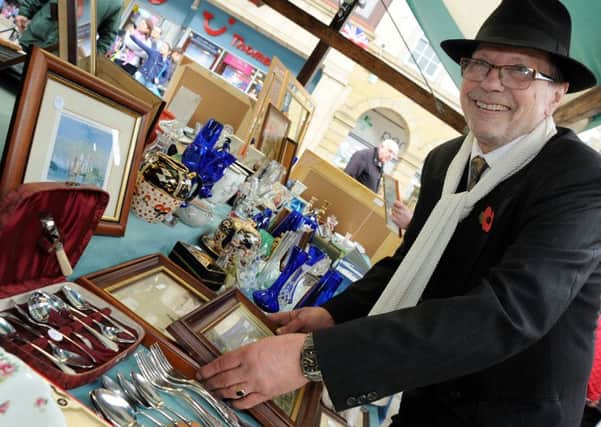 Maurice Thorpe who has been standing Chesterfield Market for 30 years, organises his stall on which he sells collectables and antiques, some from the 1940's which were being celebrated on Thursday.