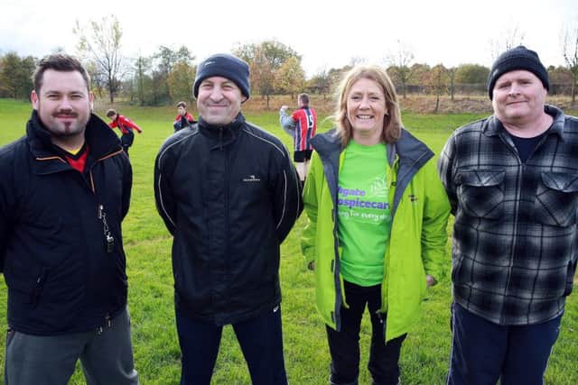 Lynn Jones from Ashgate Hospice with the team's coaches.