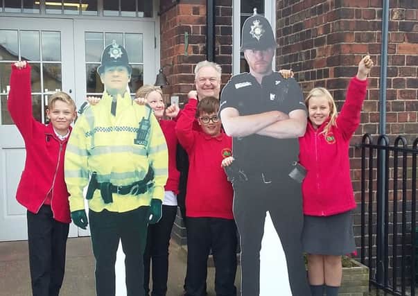 Palterton Primary School celebrating their new parking policeman.