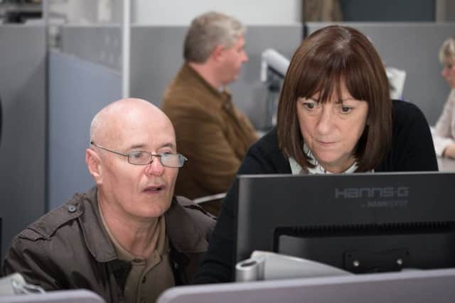 Kate Rutter with Dave Johns in a scene from I, Daniel Blake