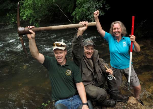 Weir removal on Peak District rivers: Alex Swann (left) Tim Jacklin and Julie Wozniczka by one of the breached weirs in the River Dove. Photo: David Bocking.