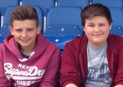 Zakk and his older brother Dominic at the football.