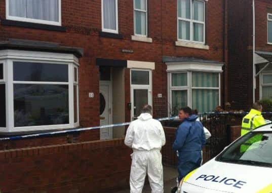 Police outside the home of Jullie Hill, on Station Road, Shirebrook, where she was found dead with deceased Rose Hill.