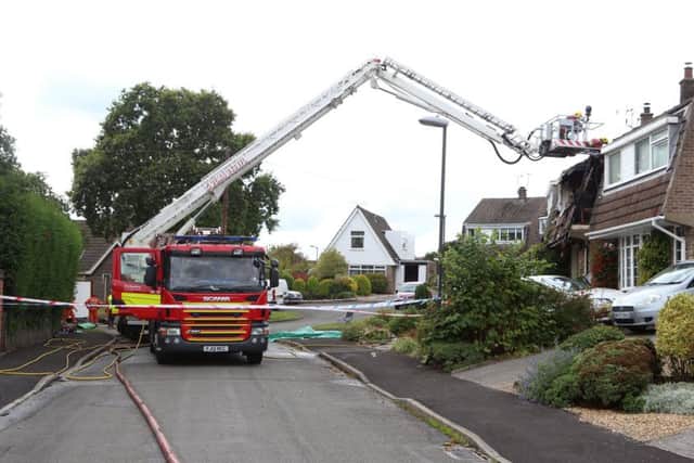 General view of Valley View Road, in Riddings, near Alfreton, Derbyshire, where fire crews are working following a suspected gas explosion, which took place in the early hours of Sunday 20 September 2015. It is thought that there could have been people in the house when the fire started.