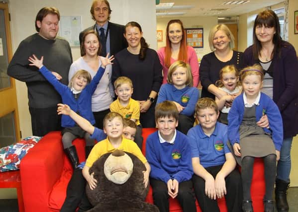 The new parental forum at Holmehall Primary with their children and head teacher Paul Husken