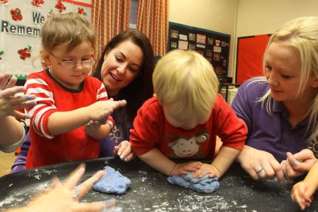 Marsh Lane Playschool, staff Lisa Weston and Danielle Cartwright mixing dough with the youngsters