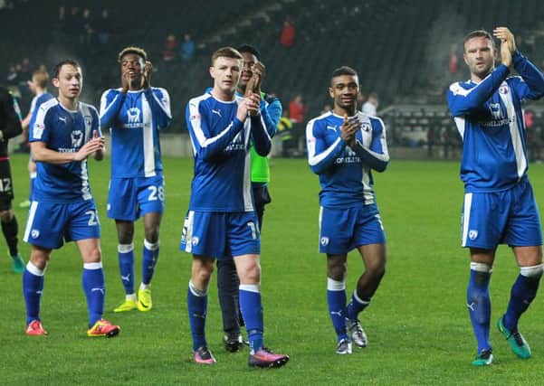 Chesterfield players salute the travelling fans