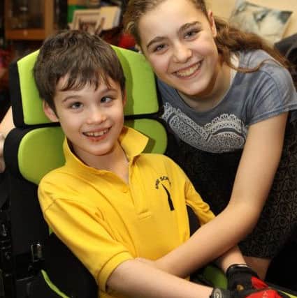 Young carer Emily Kay with her younger brother Chris