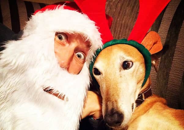 Alison Barlow, 43, from Ambergate, and her dog Looey dressed as Santa and Rudolph.
