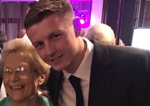 Sheila Longden with Spireites player Dion Donohue, for whom she has come up with a catchy chant