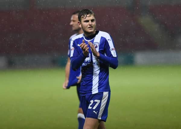 Chesterfield's  Lawrence Maguire applauds the travel fans all 74 of them (Pic: Howard Roe/ahpix.com)