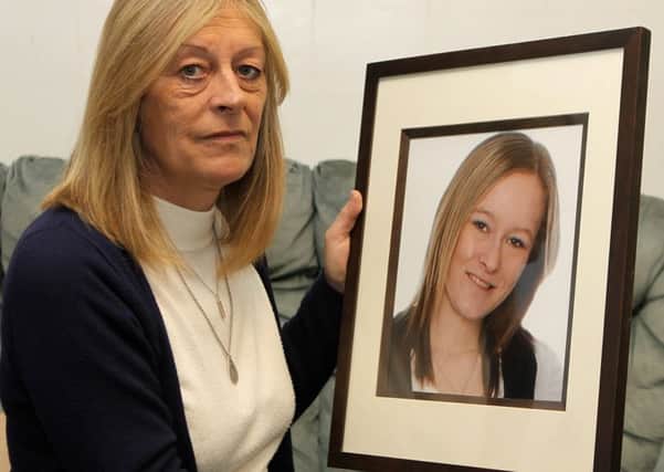 Mel Plackett with a picture of her deceased daughter Emma.