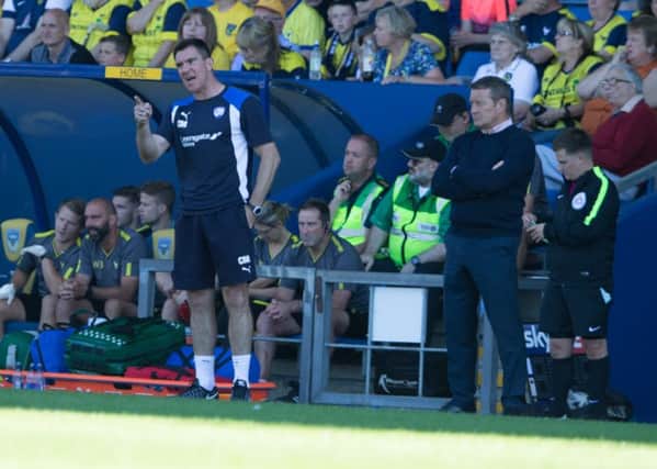 Oxford United vs Chesterfield - Chris Morgan giving out orders as Danny Wilson looks on - Pic By James Williamson