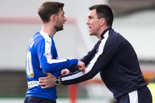 Swindon Town vs Chesterfield - Jay O'Shea and Chris Morgan have a talk on tactics - Pic By James Williamson