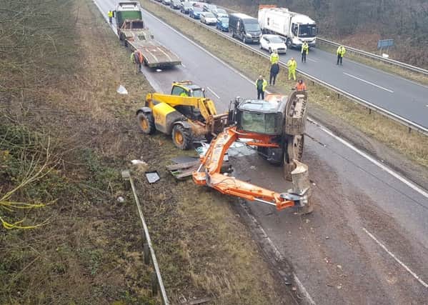 A digger which fell off the back of a lorry on the A617 near Chesterfield (Photo: Max Parkin).