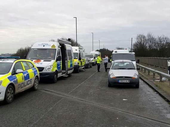 A police Safedrive Operation stops 50 cars including seven drivers using their mobile phones.