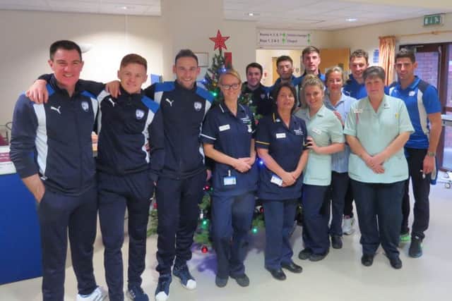 Chesterfield players and coaching staff at Ashgate Hospicecare (Pic: Scott Parker)