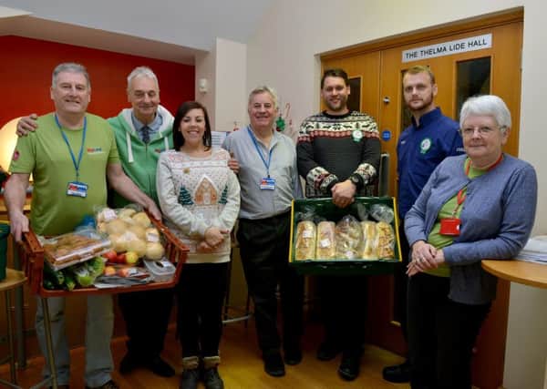 Pit Stop Diner at Grassmoor Community Centre, pictured from left are Dave Maric, Stephen Wright, Tesco community champion Nicole Murtagh, Rob Whitehead, Tesco fruit and veg manager  Ben Graham, Tesco counters manager Daniel Vaughan and Pam Hemsley