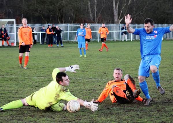 Top scorer Lee Clay forces home Clay Cross Towns seventh goal.
