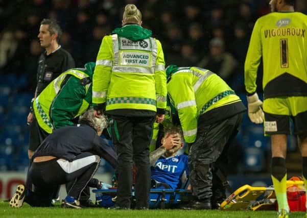 Chesterfield vs Swindon Town - Daniel Jones is stretchered off through Injury - Pic By James Williamson