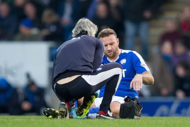 Chesterfield vs Coventry City - Ian Evatt goes down injured - Pic By James Williamson