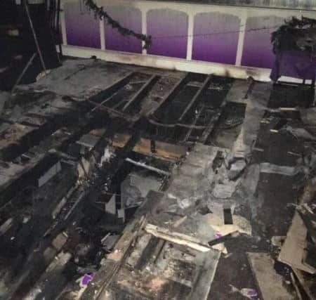 Damage to seating area of Kaash Tandoori after blaze at USA Fried Chicken. Picture submitted.