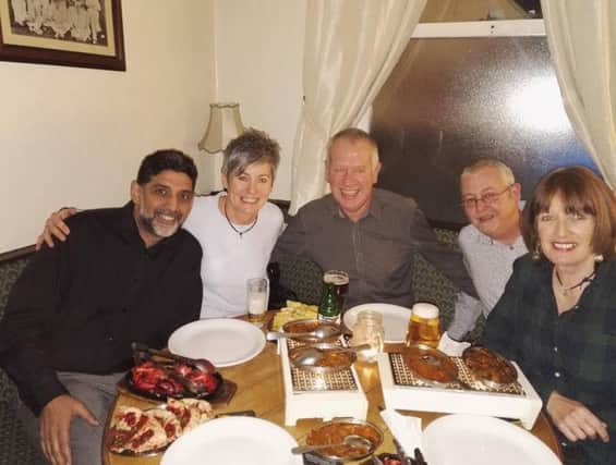 Owner of Kaash Tandoori, Ash (left), with diners at The Derby Tup. Picture submitted.