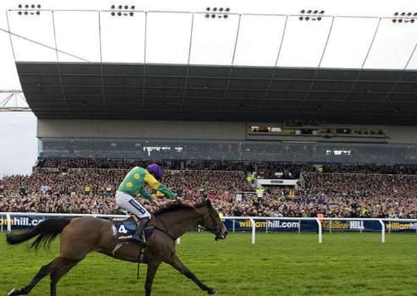 Kauto Star strides to one of his record-breaking five victories in the King George VI Chase at Kempton Park.