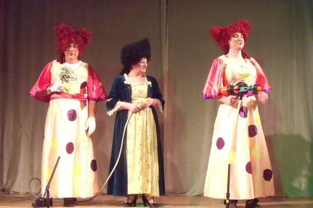 Paul Holland (Grizelda), Donna Knowles (Baroness Hatty Hardup) and Chris Peck (Gertrude) in Cinderella at Bolsover Drama Group's production of Cinderella.