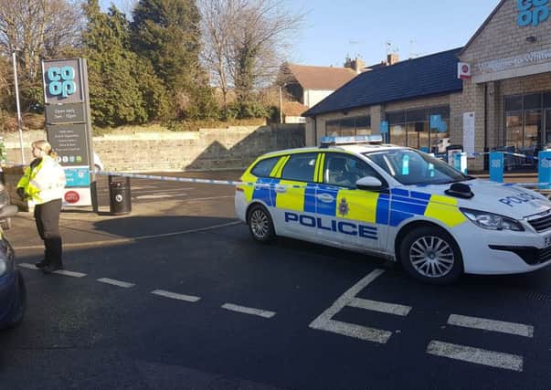 Police at the scene outside Whitwell Co-op