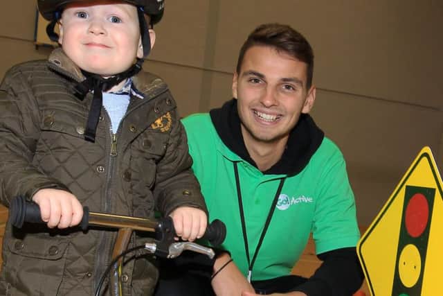 The launch of the new GO! Active @ The Arc leisure facility in Clowne. Harley Wood, three, with staff member Alex Sennett trying out a balance bike.