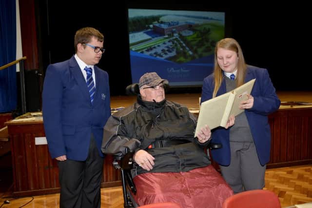 Ex pupils of Mortimer Wilson and Alfreton Grange Arts College were invited to visit their old school for the last time before it is demolished to be replaced by a new building, the David Nieper Academy, pictured is David Pryor talking to current pupils