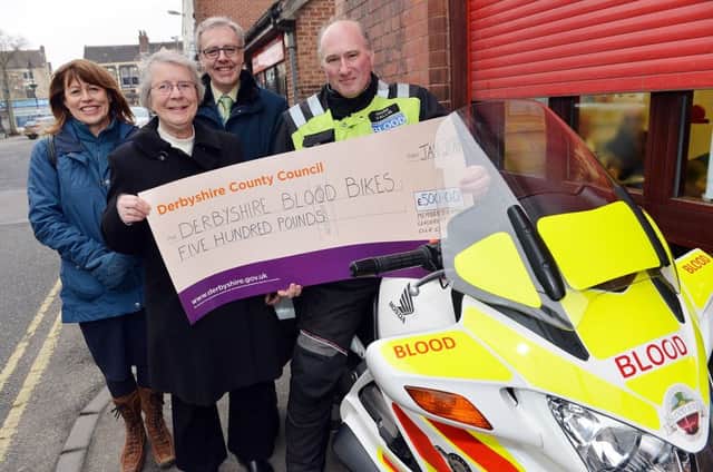 Celia cox hands over a cheque from the derbyshire county council leadership fund to Derbyshire Blood bikes. Sandra Dodds blood bank manager Derby royal hospital, Cllr Celia Cox Derbyshire CC, Steve Kyte pathology general manager Derby Royal hospital and Mark Vallis from Derbyshire blood bikes.