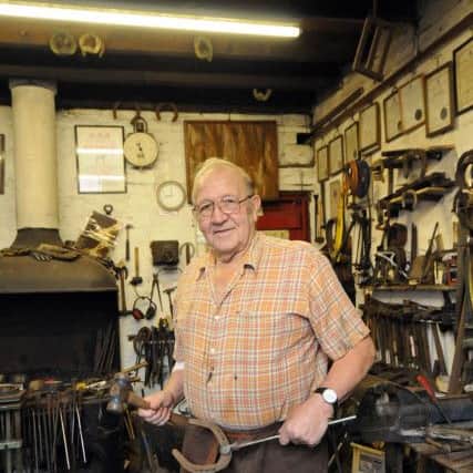 Doug Bradbury in his forge at his Clay Cross home which forms part of his museum.