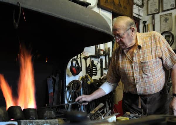 Doug Bradbury in his forge at his Clay Cross home which forms part of his museum.