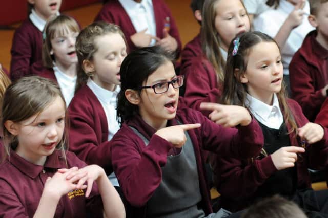 Pupils from the Arkwright Primary School take part in the Sign to Sing campaign having learnt new songs with sign language from their teacher Andrea Mooney, which invovled the whole school.