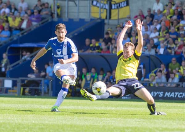 Oxford United vs Chesterfield - Ched Evans contests a header - Pic By James Williamson