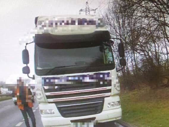 Police caught a lorry driver using his mobile phone will operating a 44-ton LGV.
