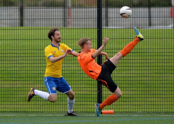 Action from a clash between title rivals FC Bolsover and Clay Cross Town earlier this season.