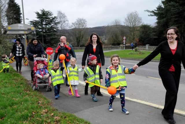 Staff, children and parents from The Young Explorers nursery in Darley Dale make their case for a safe crossing over the A6.