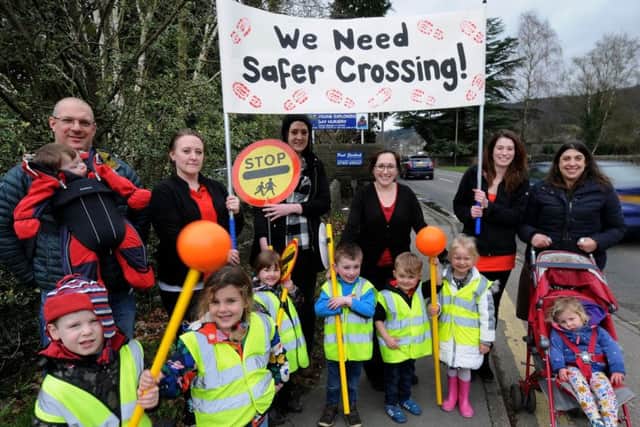 Staff, children and parents from The Young Explorers nursery in Darley Dale make their case for a safe crossing over the A6.