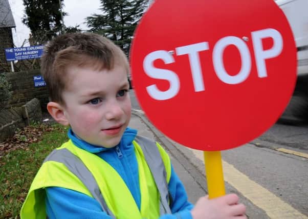 Evan Liggins, 4, who goes to The Young Explorers nursery in Darley Dale joins staff and parents in their request for a safe crossing over the A6.