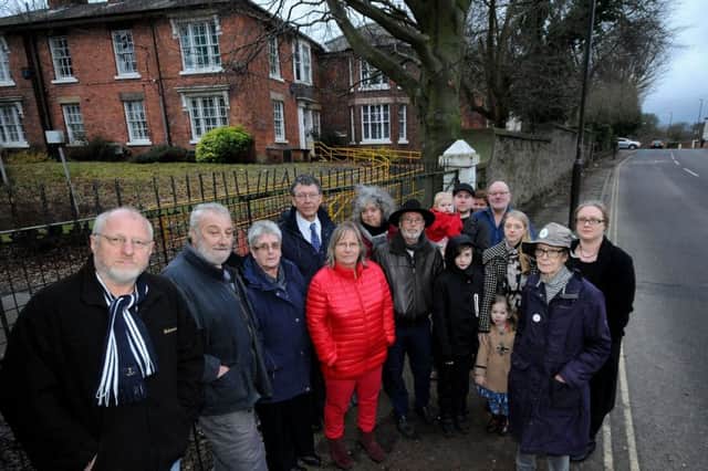 Local residents opposed to the demolition of the Shrubberies join forces in protest.