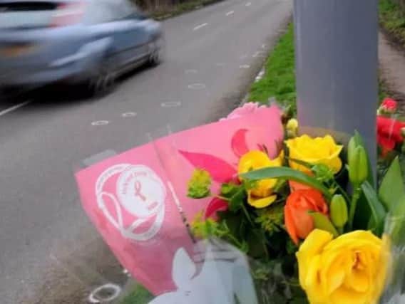 Floral tributes on Fordbridge Lane, South Normanton, following the fatal crash.